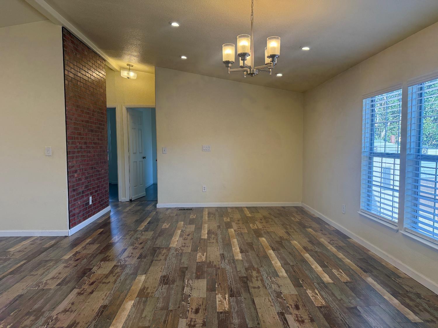 908 Atlantic Street, Unit 33 Roseville, CA 95678 - Photo 7 of 31 a view of empty room with wooden floor and fan