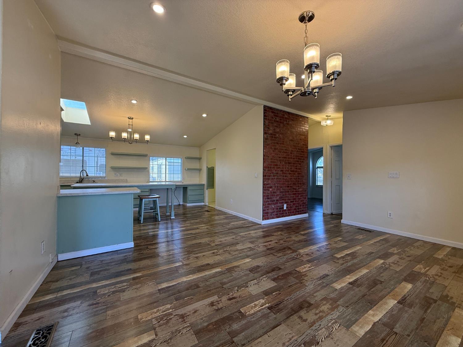 908 Atlantic Street, Unit 33 Roseville, CA 95678 - Photo 8 of 31 a view of a room with kitchen island stainless steel appliances wooden floor dining table and chair
