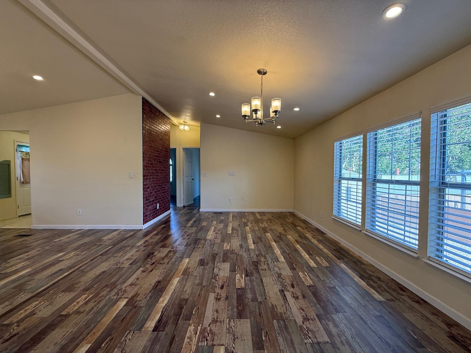 908 Atlantic Street, Unit 33 Roseville, CA 95678 - Photo 9 of 31 a view of a livingroom with a chandelier