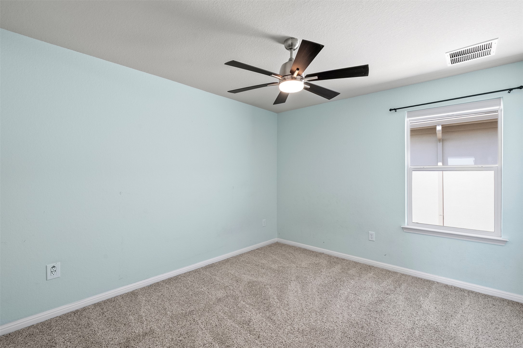 120 Ellinger Road Georgetown, TX 78626 - Photo 23 of 28 Room featuring light blue walls and gray carpet flooring