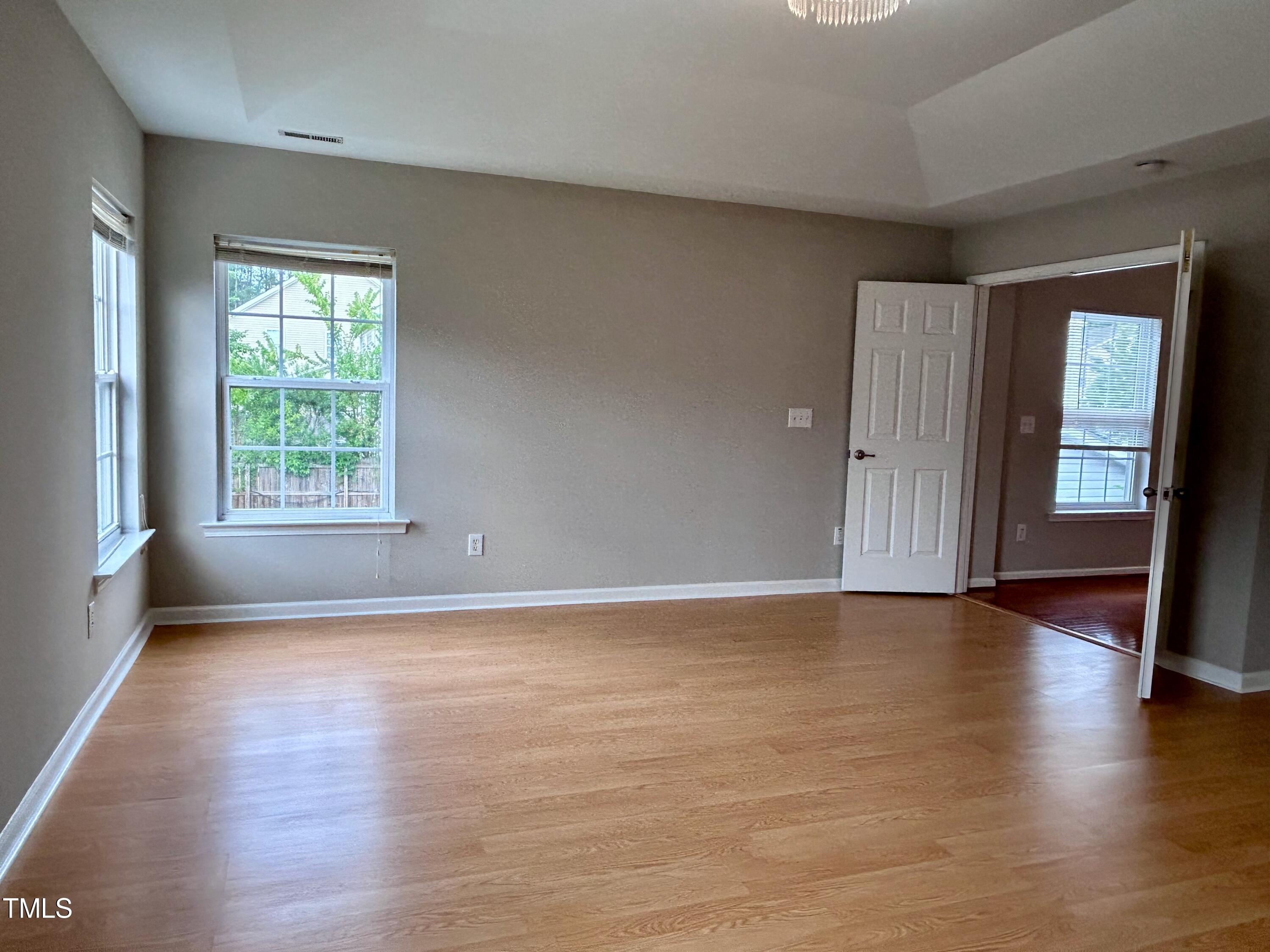 4029 Wester Road Raleigh, NC 27604 - Photo 29 of 37 an empty room with wooden floor and windows