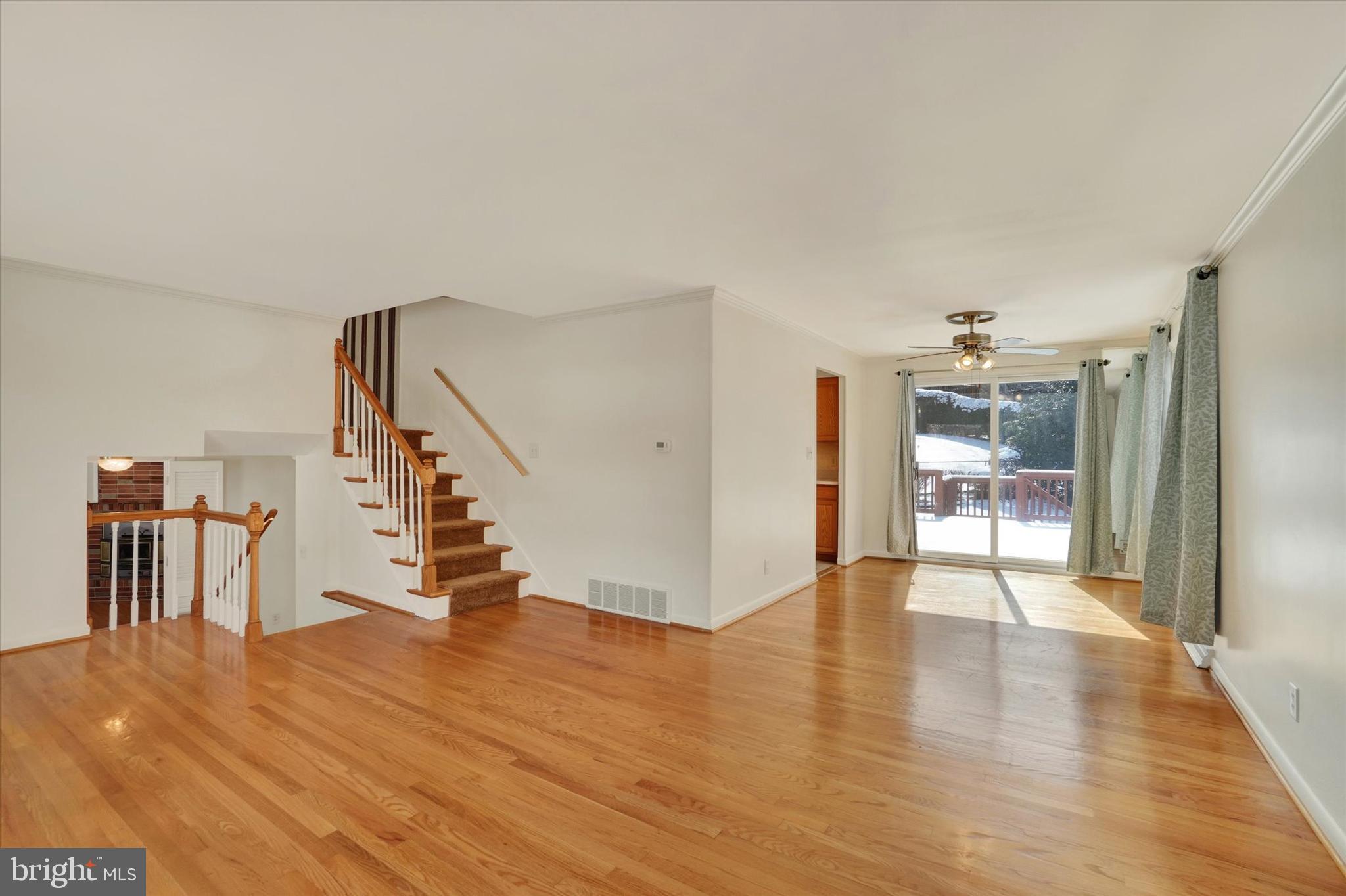 2670 Raleigh Drive York, PA 17402 - Photo 11 of 33 a view of an empty room with wooden floor and a living room
