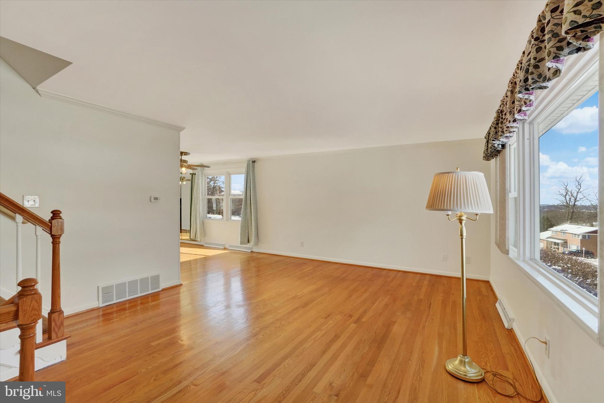 2670 Raleigh Drive York, PA 17402 - Photo 12 of 33 a view of an empty room with wooden floor and a window