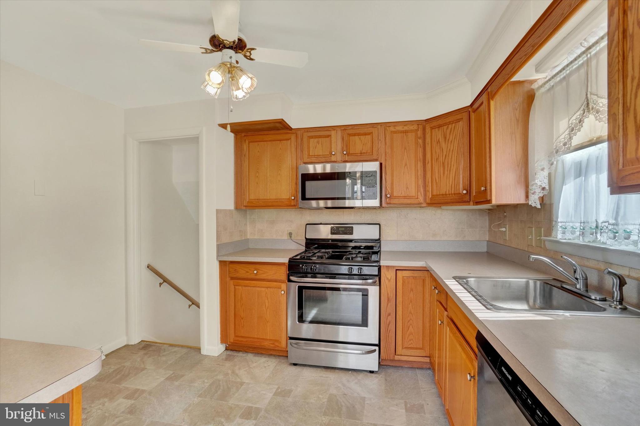 2670 Raleigh Drive York, PA 17402 - Photo 15 of 33 a kitchen with a stove a sink and a microwave