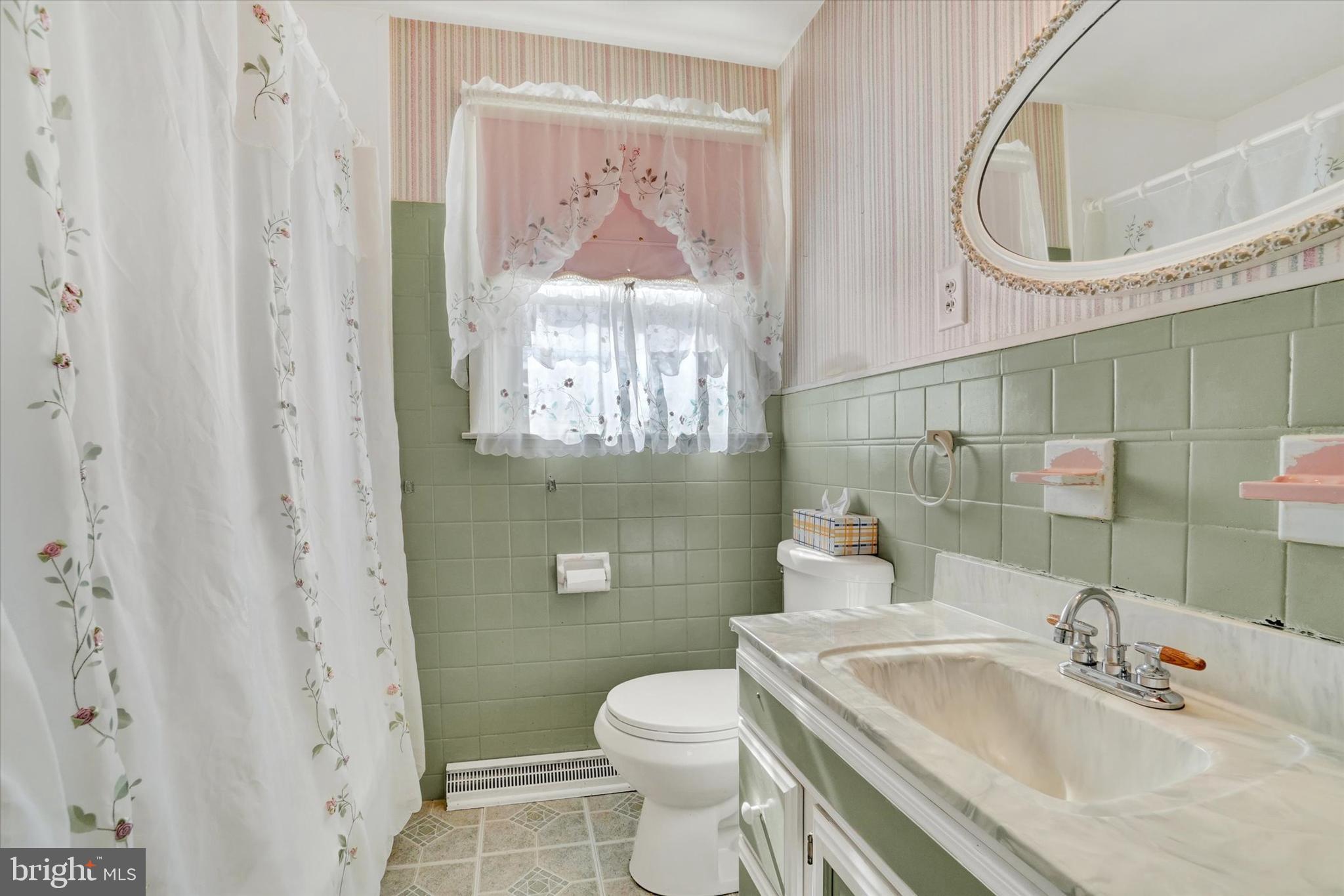 2670 Raleigh Drive York, PA 17402 - Photo 19 of 33 a bathroom with a sink a toilet and a mirror