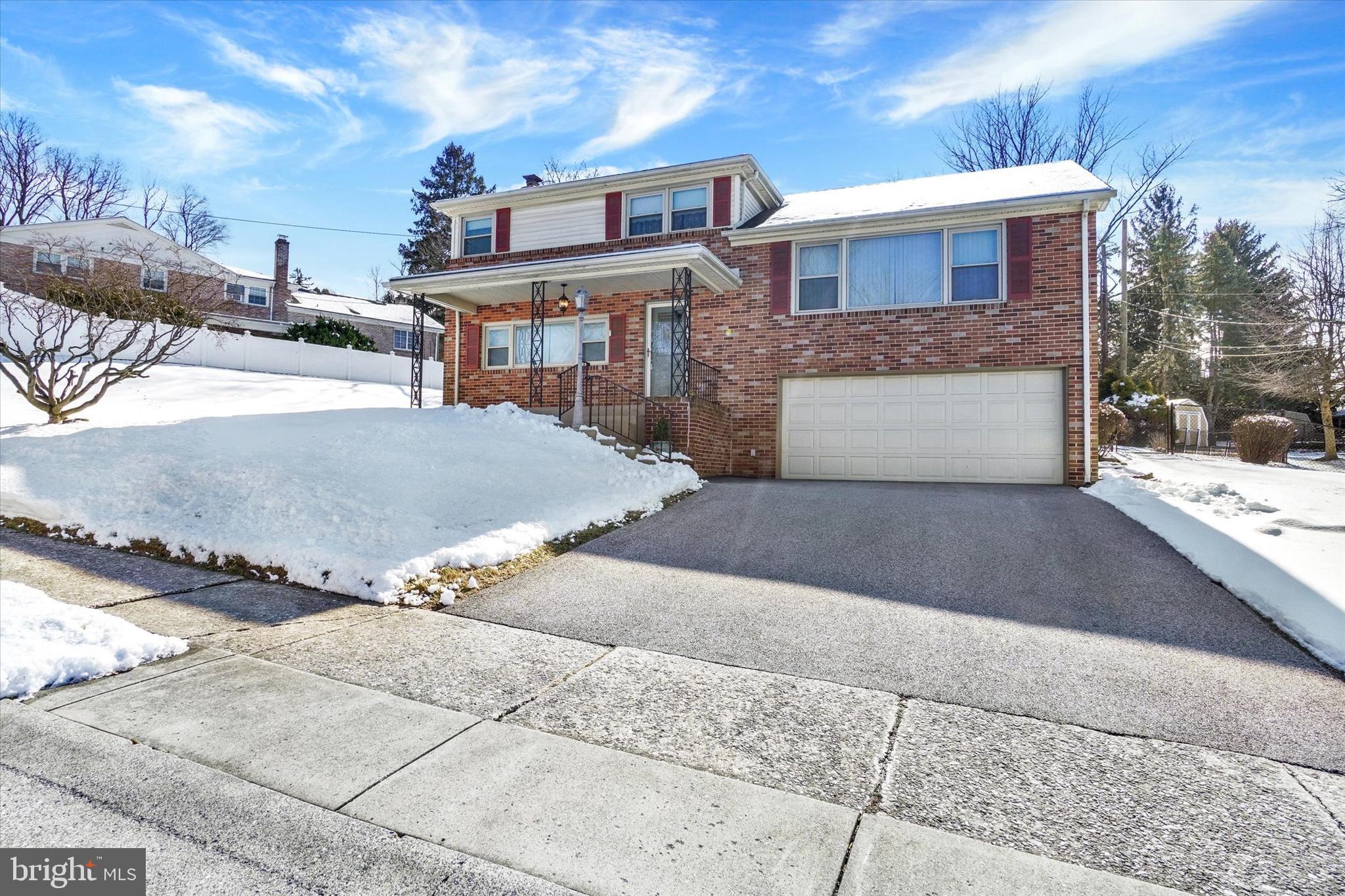 2670 Raleigh Drive York, PA 17402 - Photo 2 of 33 a front view of a house with a yard