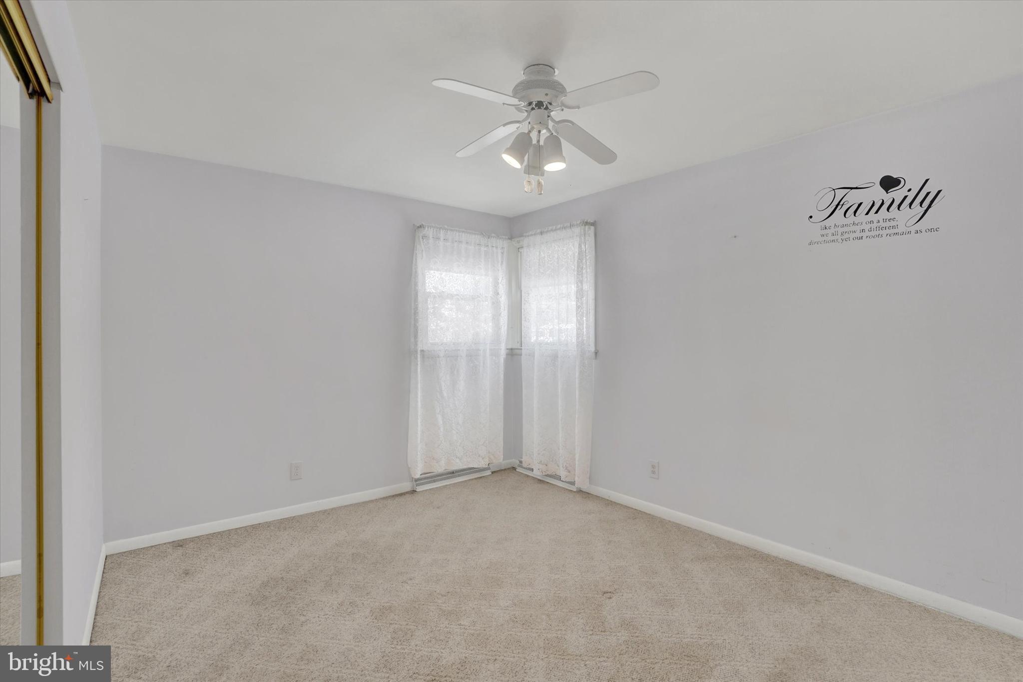 2670 Raleigh Drive York, PA 17402 - Photo 22 of 33 an empty room with windows and fan