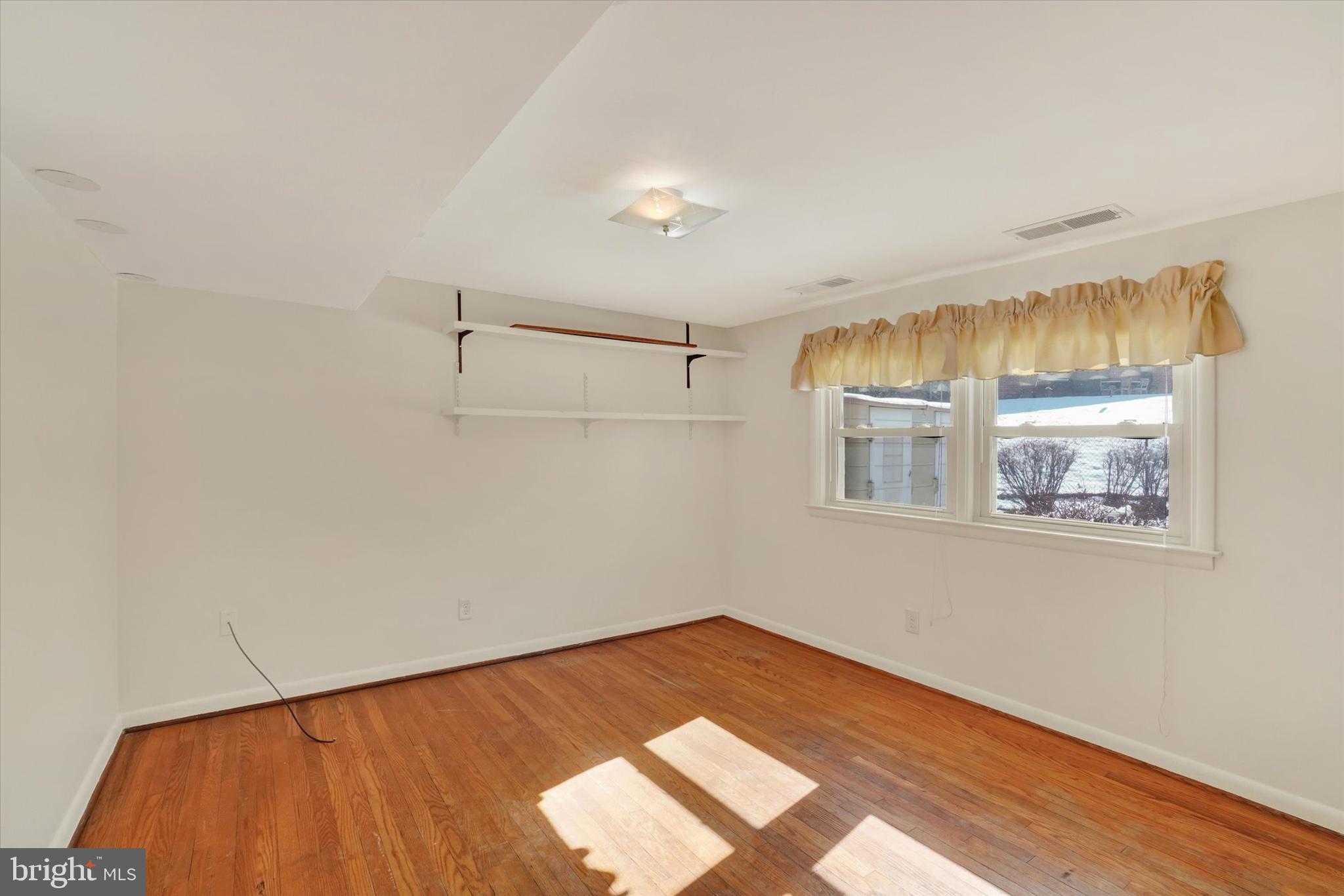 2670 Raleigh Drive York, PA 17402 - Photo 6 of 33 a view of empty room with wooden floor