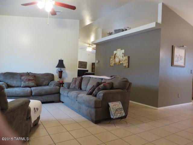 963 Calle Amarillo Rio Rico, AZ 85648 - Photo 20 of 31 a living room with furniture and a chandelier