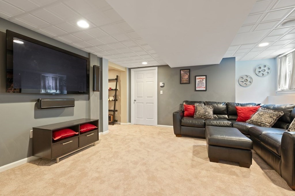 3 Symphony Drive Easton, MA 02356 - Photo 21 of 42 a living room with furniture and a flat screen tv