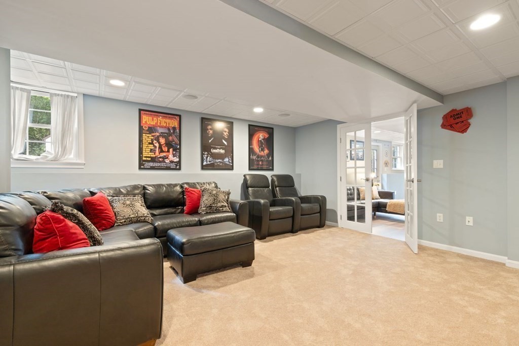 3 Symphony Drive Easton, MA 02356 - Photo 22 of 42 a living room with furniture and a flat screen tv