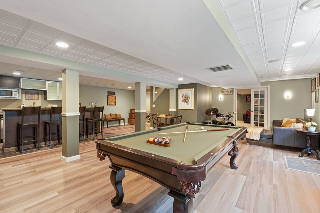 3 Symphony Drive Easton, MA 02356 - Photo 24 of 42 a living room with stainless steel appliances furniture stove and wooden floor
