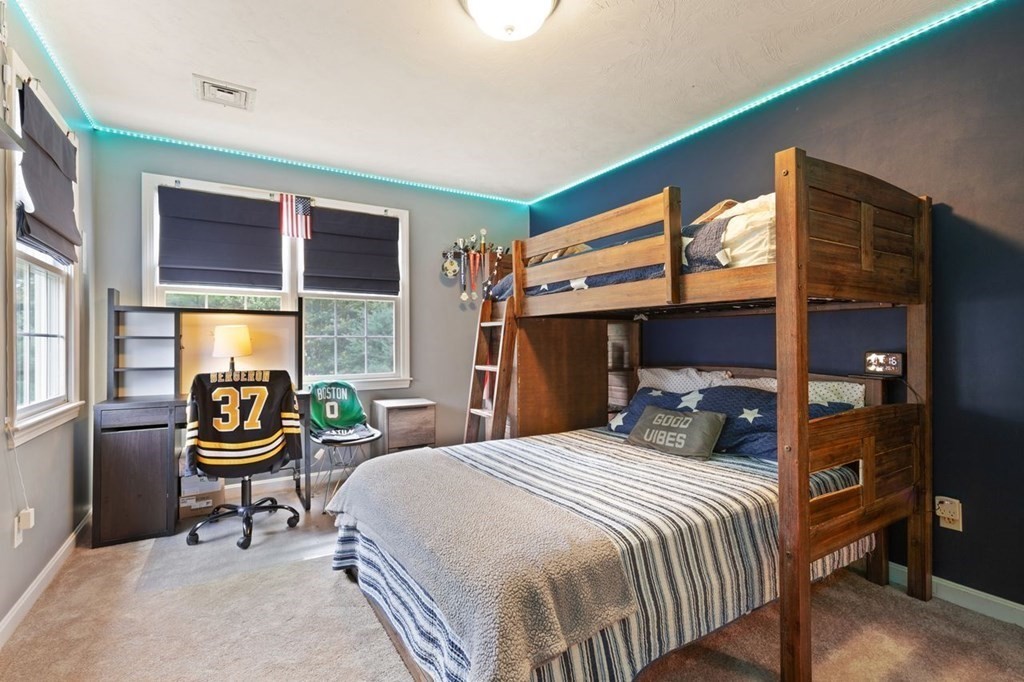 3 Symphony Drive Easton, MA 02356 - Photo 31 of 42 a bedroom with a bed and a table in it