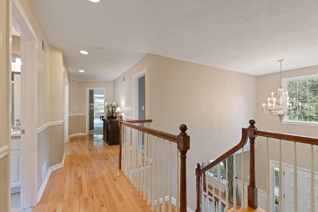 3 Symphony Drive Easton, MA 02356 - Photo 33 of 42 a view of a hallway with a bedroom and wooden floor