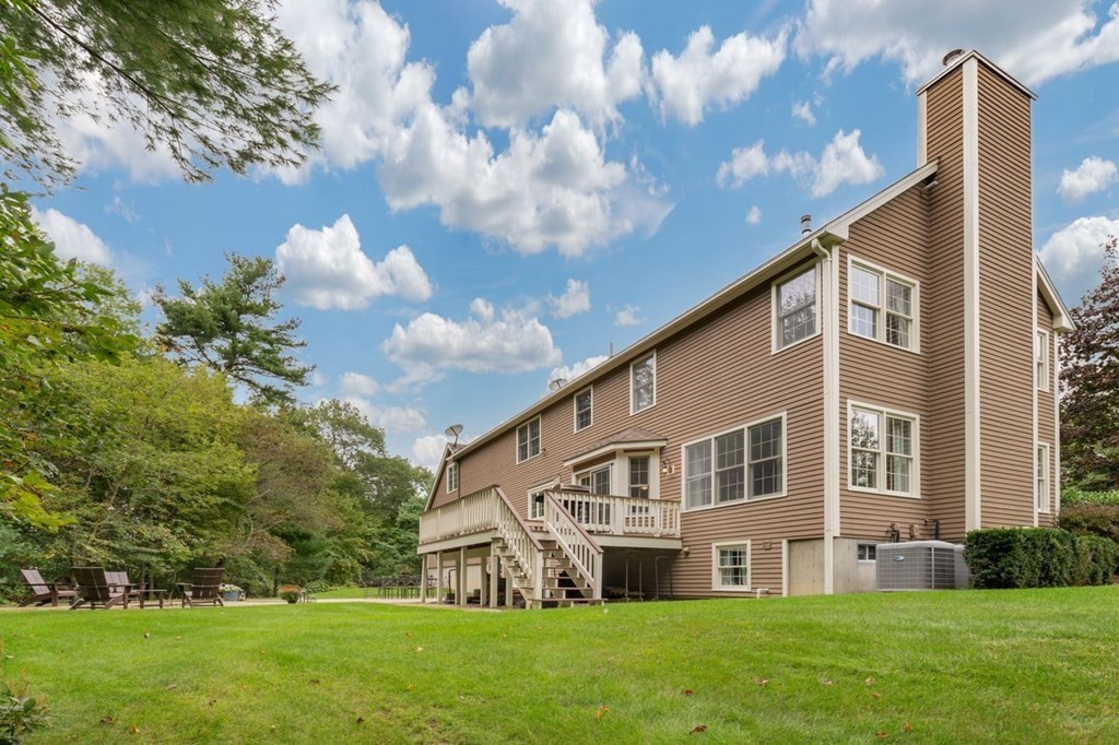 3 Symphony Drive Easton, MA 02356 - Photo 35 of 42 a front view of house with yard and green space