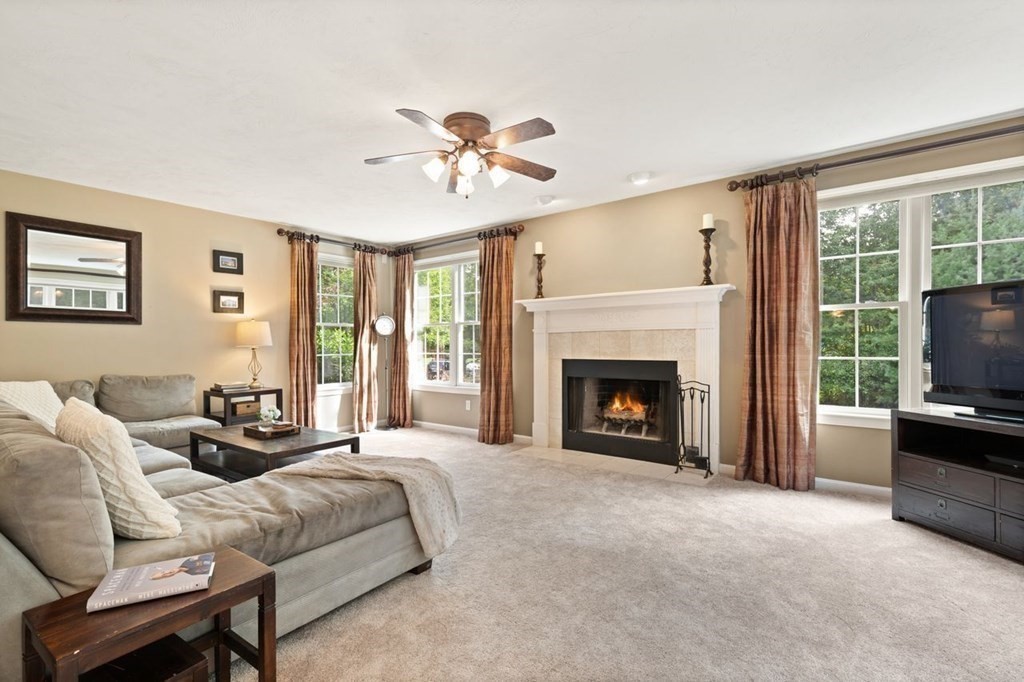 3 Symphony Drive Easton, MA 02356 - Photo 8 of 42 a spacious bedroom with a bed and a fireplace