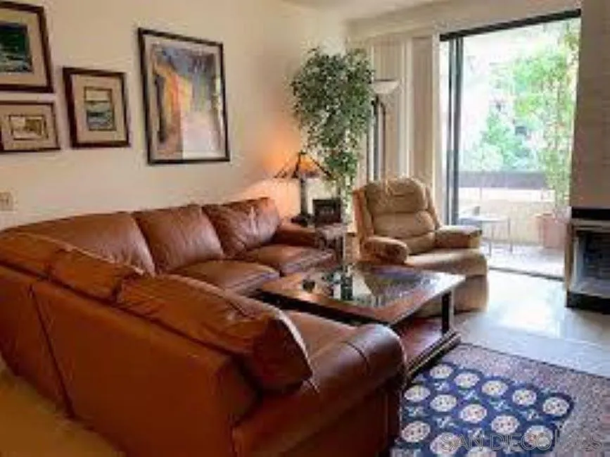 5845 Friars Road, Unit 1206 San Diego, CA 92110 - Photo 2 of 9 a living room with furniture and a large window
