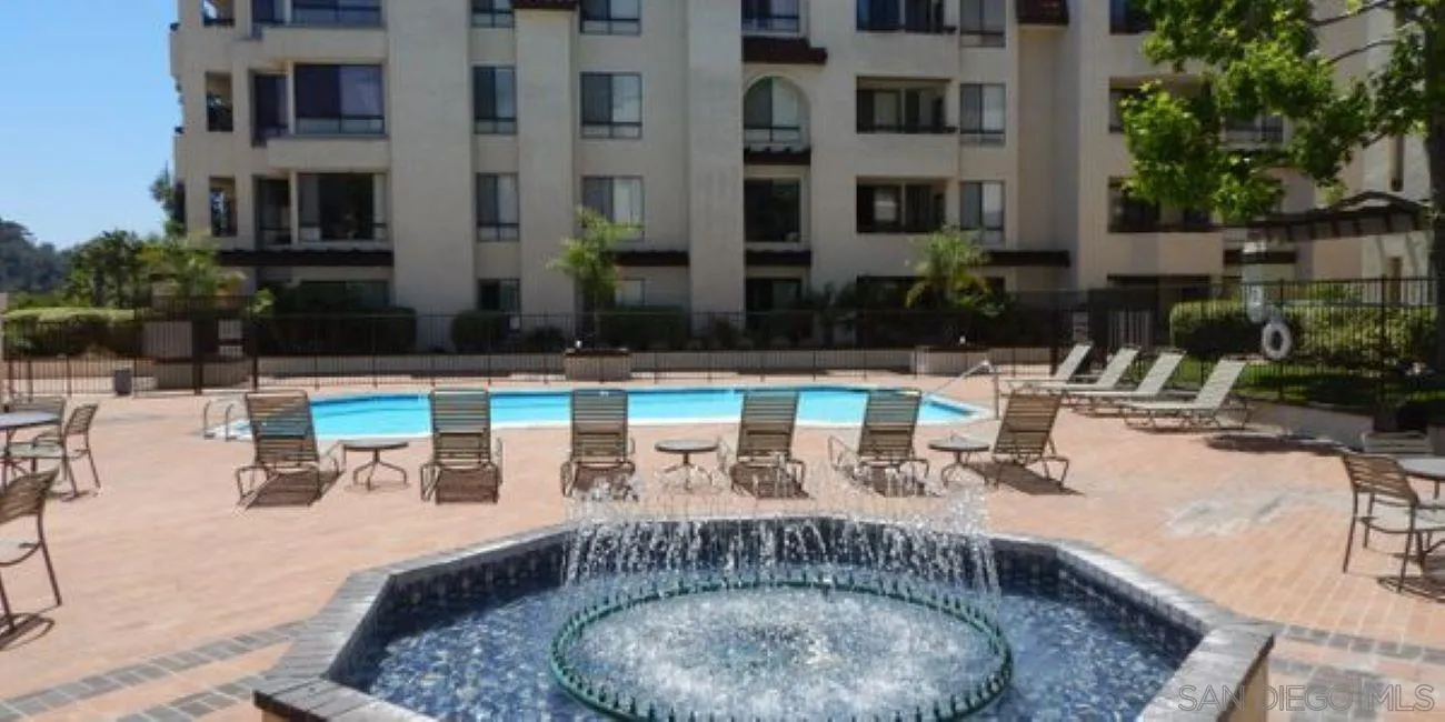 5845 Friars Road, Unit 1206 San Diego, CA 92110 - Photo 8 of 9 a view of a swimming pool with outdoor seating