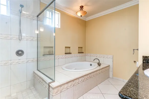 a bathroom with a tub and a shower