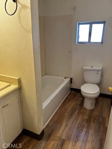 a view of a livingroom with wooden floor