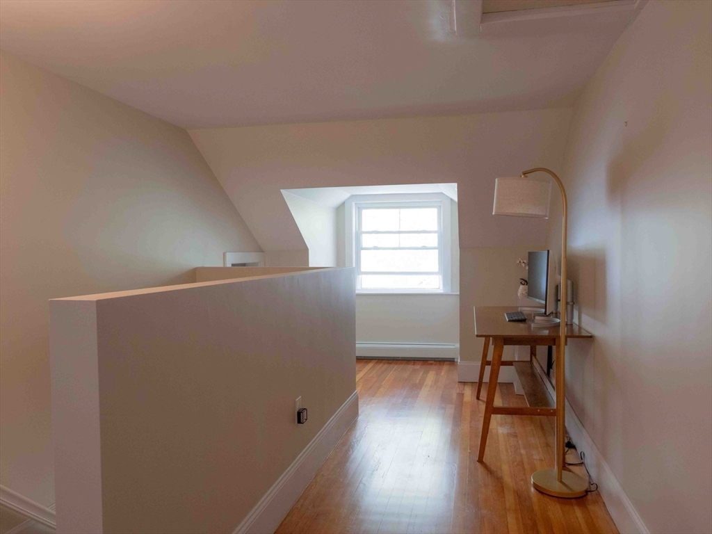 149 High Street, Unit 3 Danvers, MA 01923 - Photo 15 of 19 a view of a livingroom with wooden floor and a window
