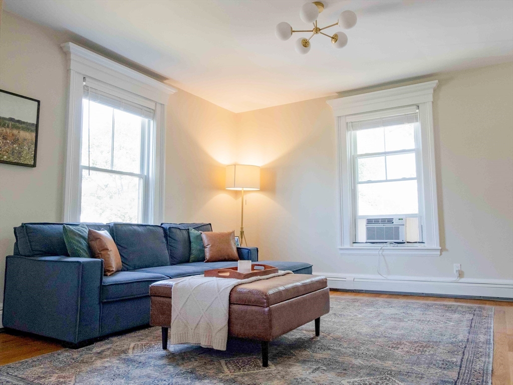 149 High Street, Unit 3 Danvers, MA 01923 - Photo 5 of 19 a living room with a couch and a window