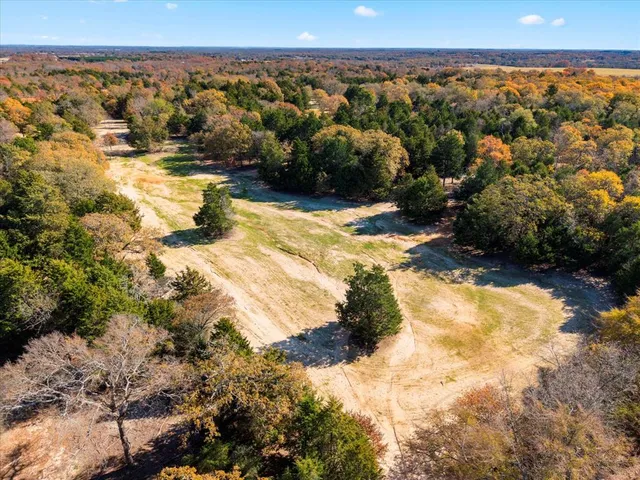 a view of a yard with a lake view