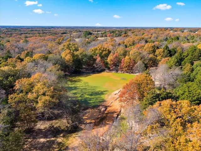 a view of a outdoor space with snow on the road