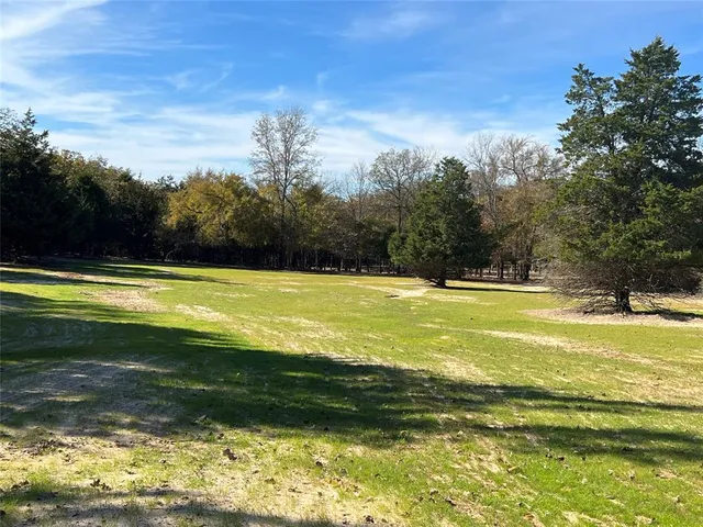 a view of a swimming pool and an outdoor space