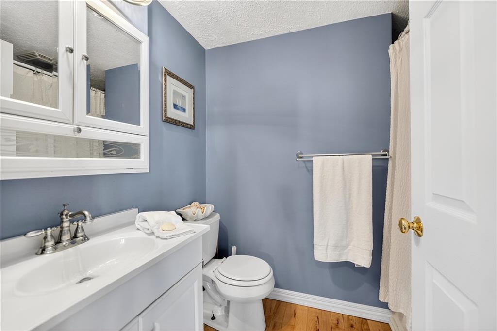 28 Whitaker Street Burgettstown, PA 15021 - Photo 22 of 50 a bathroom with a sink toilet and a mirror