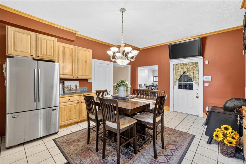 28 Whitaker Street Burgettstown, PA 15021 - Photo 25 of 50 a view of a dining room with furniture and chandelier