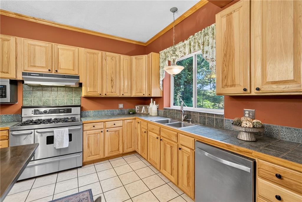 28 Whitaker Street Burgettstown, PA 15021 - Photo 26 of 50 a kitchen with appliances cabinets and a sink