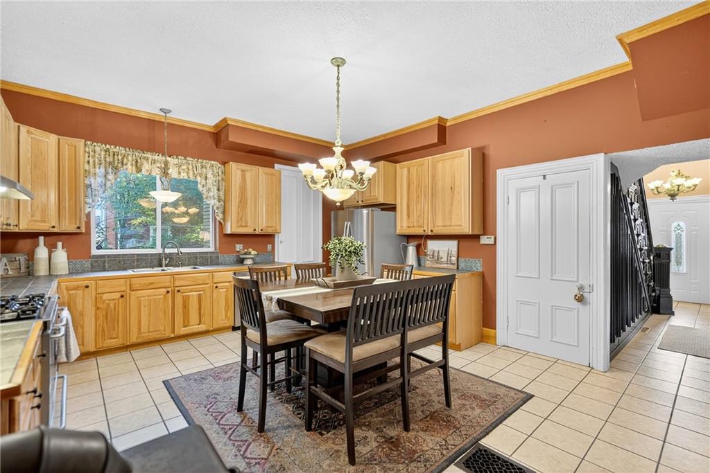 28 Whitaker Street Burgettstown, PA 15021 - Photo 27 of 50 a dining room with furniture a chandelier and window