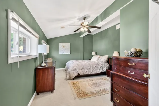 a bedroom with a bed and window