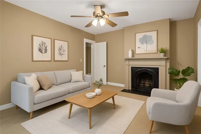 a living room with furniture and a fireplace