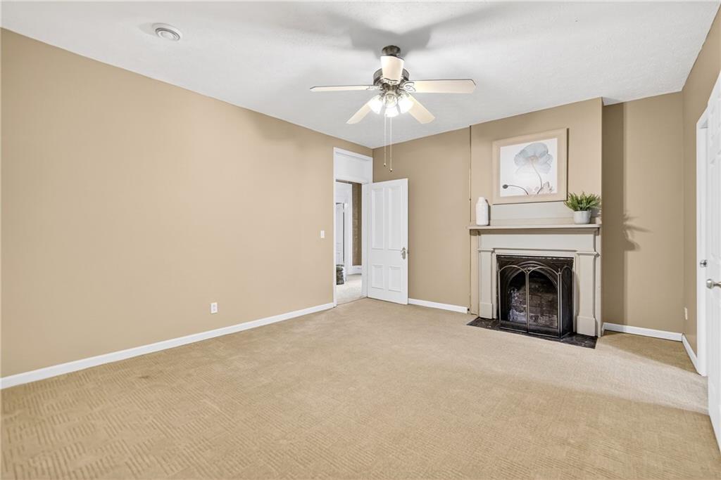 28 Whitaker Street Burgettstown, PA 15021 - Photo 43 of 50 a view of an empty room with chandelier fan and fire place