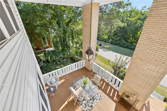 a view of balcony with furniture