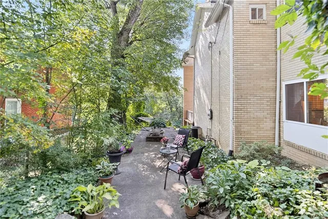 a view of a backyard with sitting area
