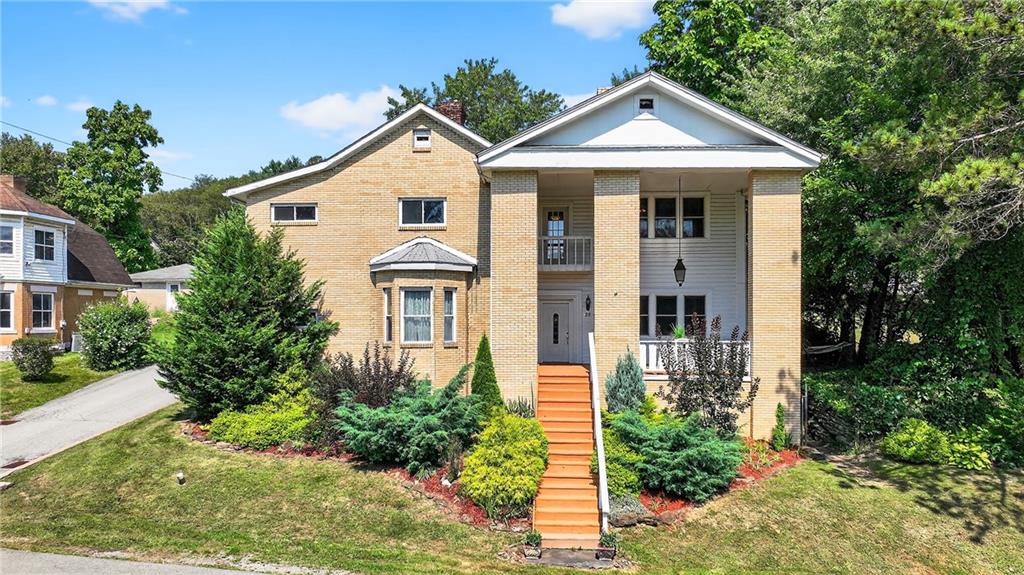 28 Whitaker Street Burgettstown, PA 15021 - Photo 47 of 50 a front view of a house with a yard and trees