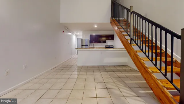 a view of a kitchen with a sink and a rug