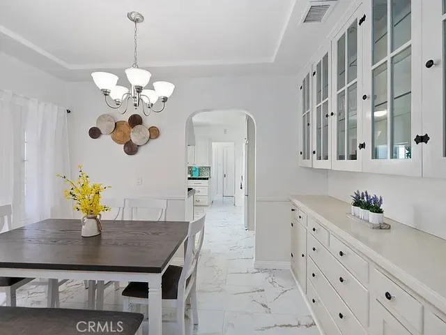 a view of a dining room and chandelier