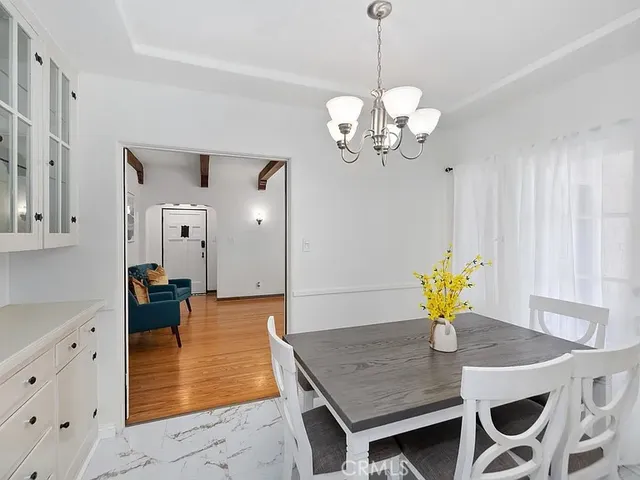 a view of a dining room and chandelier