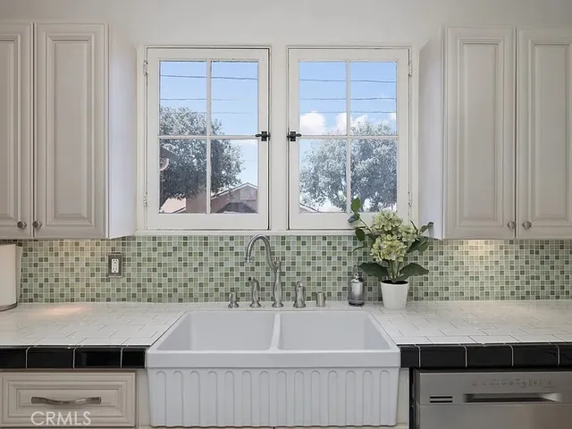 a bath tub sitting in a bathroom next to a window