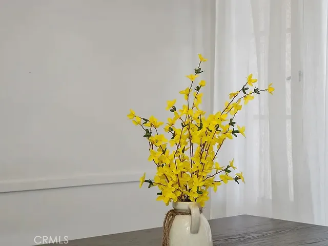 a vase of flowers sitting on a table