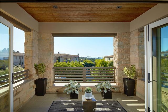 a view of a chairs and table in a terrace