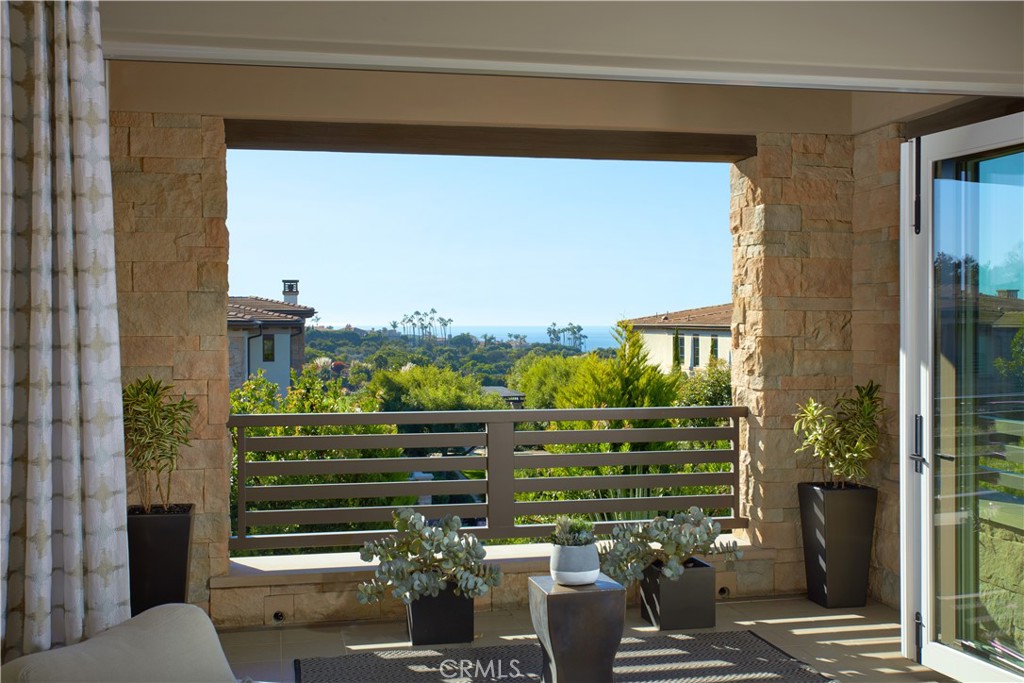 72 Monarch Beach Resort South Dana Point, CA 92629 - Photo 17 of 26 a view of a balcony with dining table and chairs