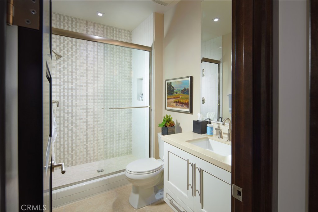 72 Monarch Beach Resort South Dana Point, CA 92629 - Photo 24 of 26 a bathroom with a sink a toilet and shower