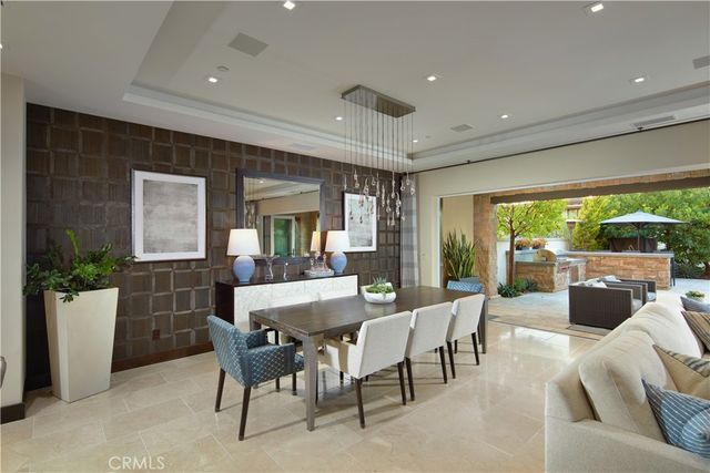 a view of a patio with couches and potted plants
