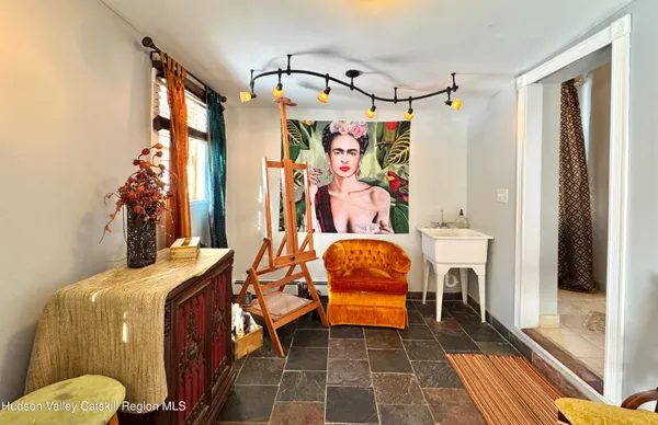 a view of a room that has a bed and a window in it
