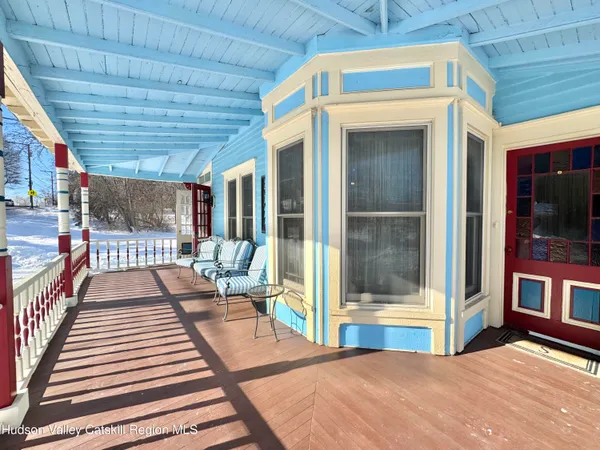 a view of a balcony with chairs